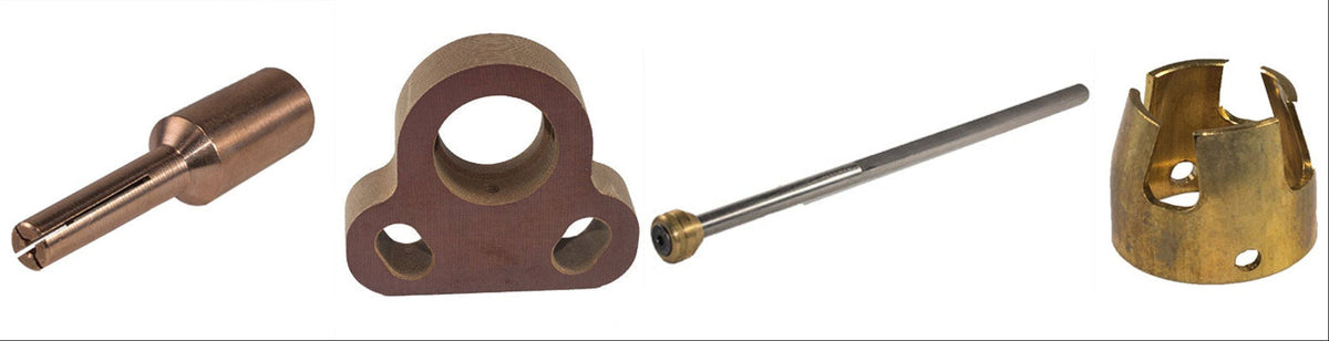 Collection of brass mechanical components on a white background